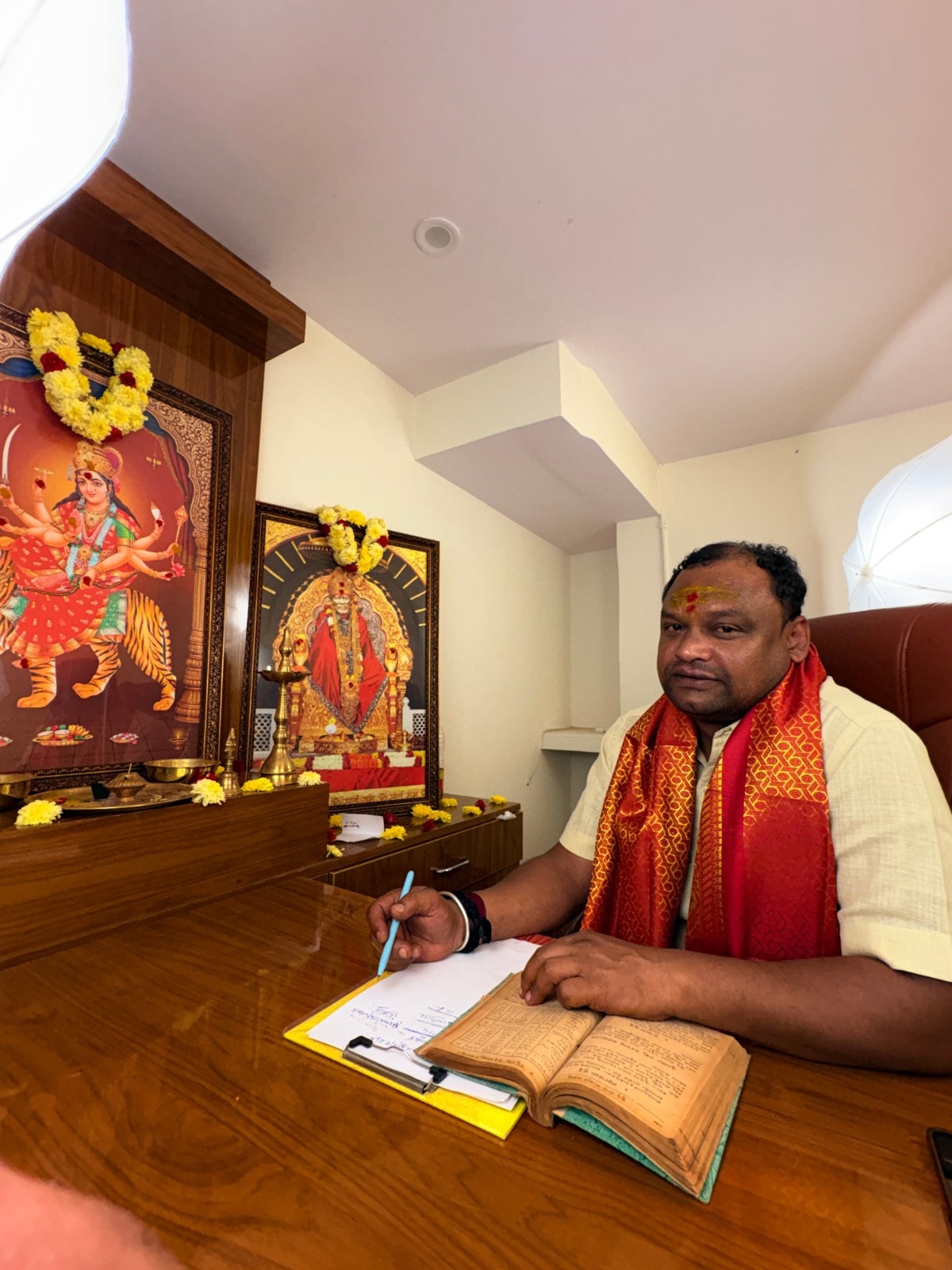 Astrology consultation room with devotional altar